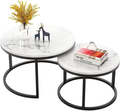 Two round marble coffee tables with decorative items on a white background
