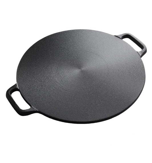 Black cast iron skillet on a white background