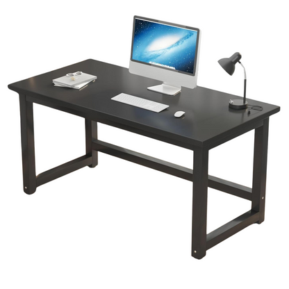 A black office desk with a computer monitor, keyboard, mouse, and a desk lamp on top.