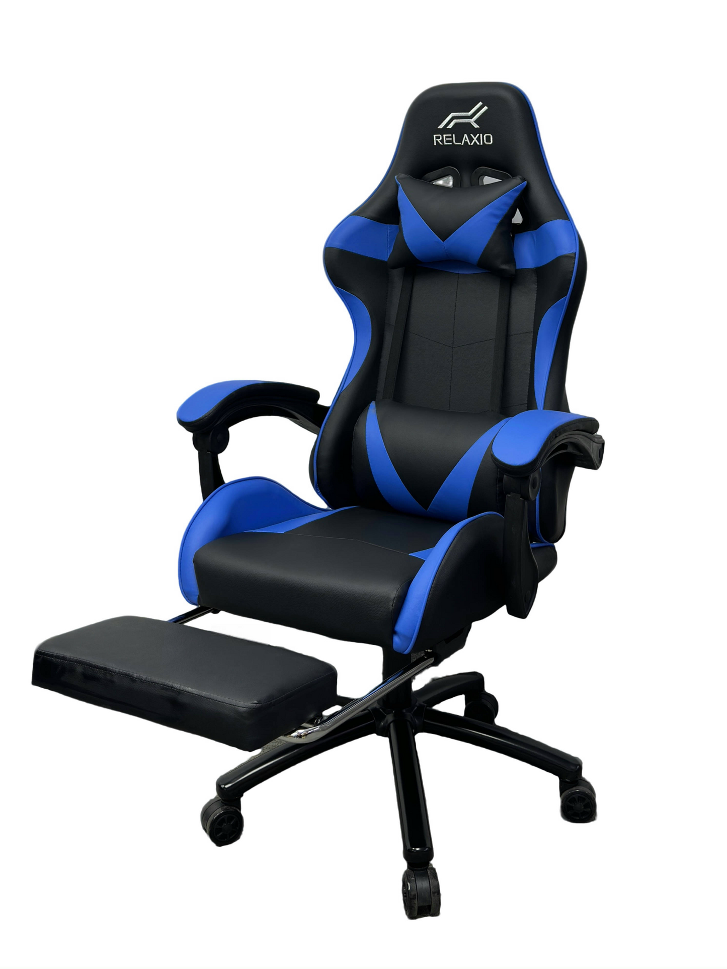 Black and white gaming chair with headrest and footrest, featuring an ergonomic design with a gas lift, cushion, and a steel backrest.