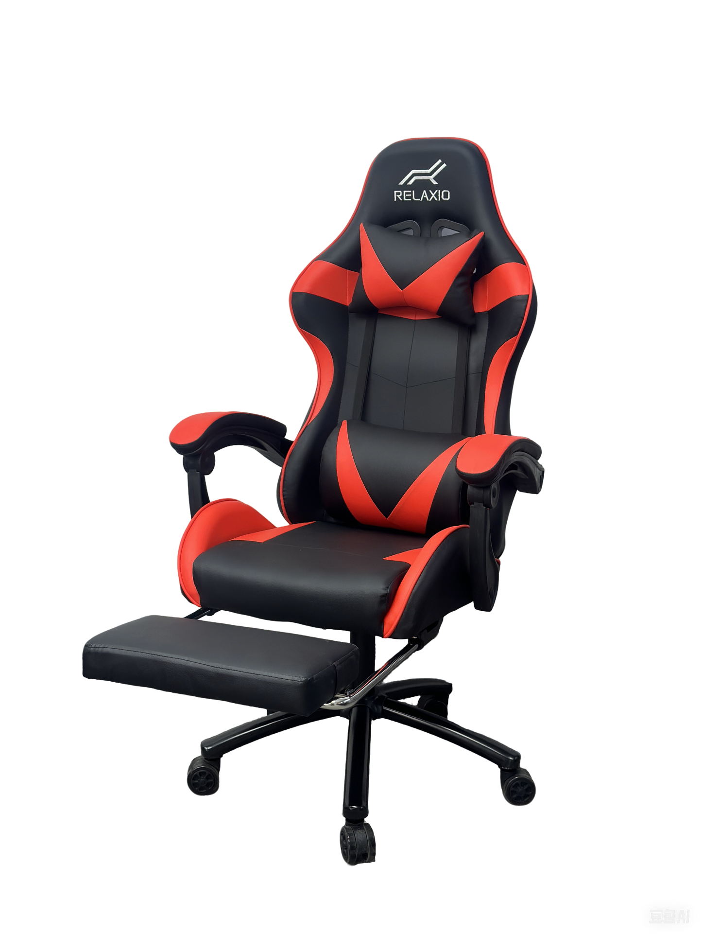 Black and white gaming chair with headrest and footrest, featuring an ergonomic design with a gas lift, cushion, and a steel backrest.