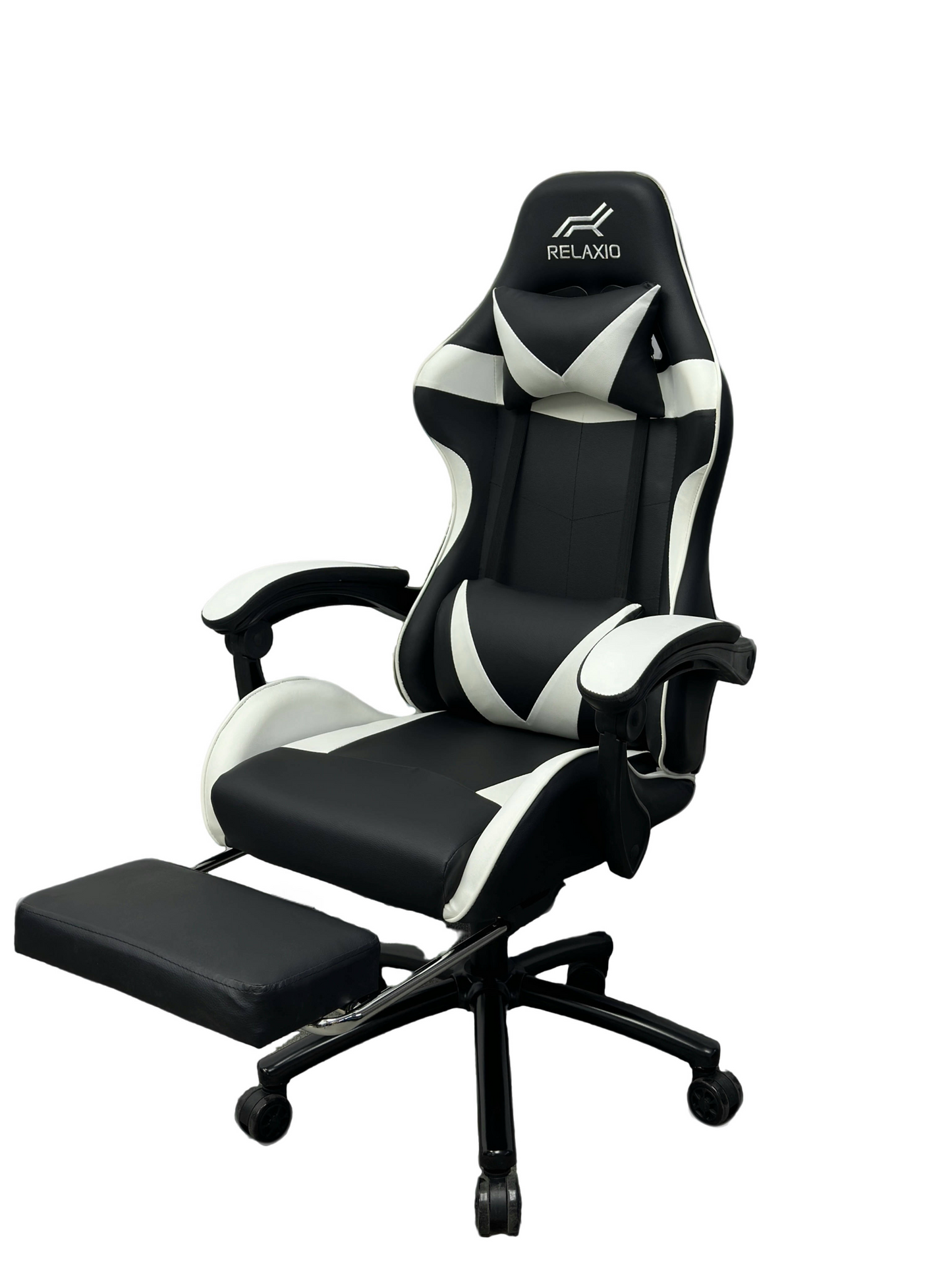 Black and white gaming chair with headrest and footrest, featuring an ergonomic design with a gas lift, cushion, and a steel backrest.