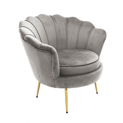 Gray velvet armchair with gold legs on a white background