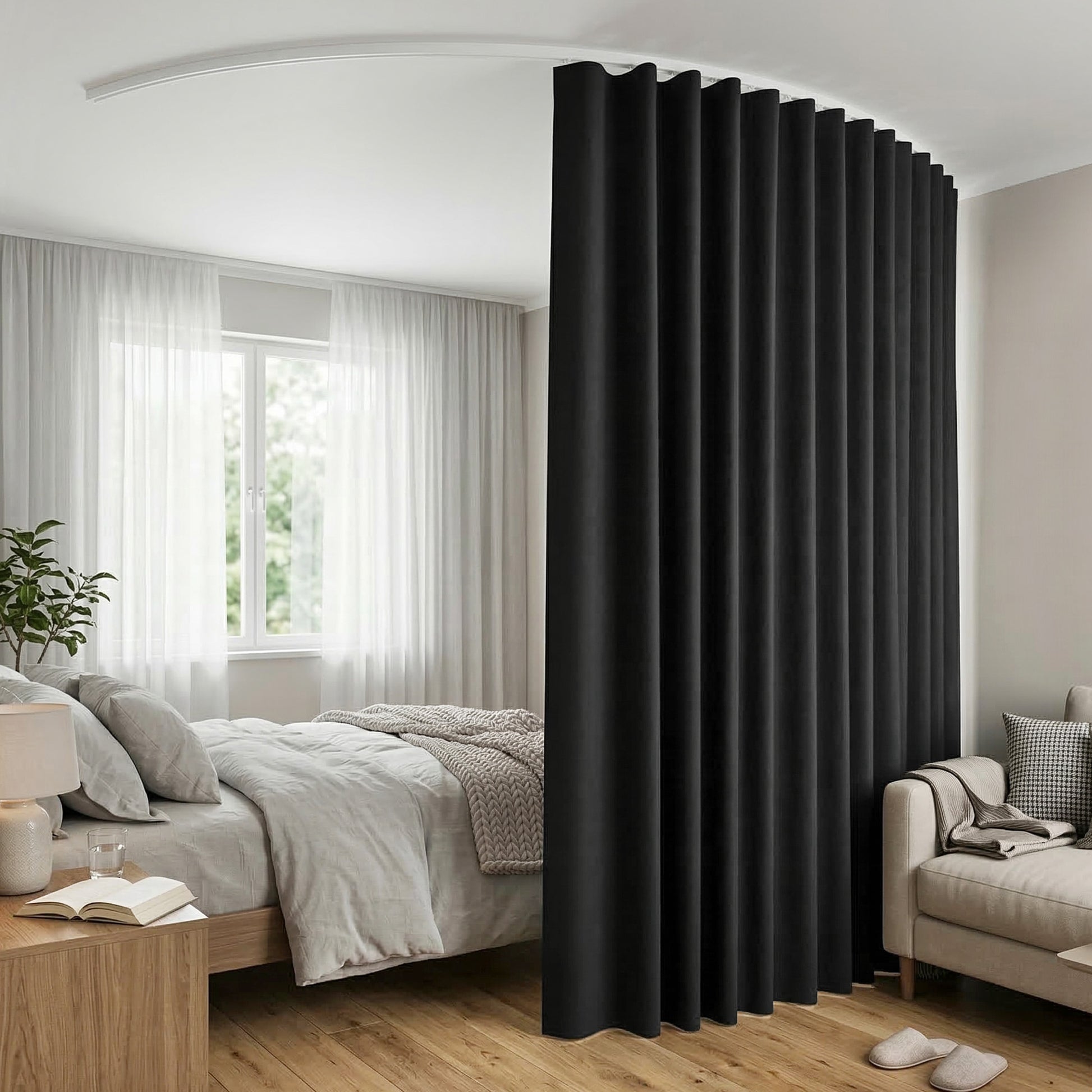 Black curtain in a bedroom setting with bed, lamp, and sofa.